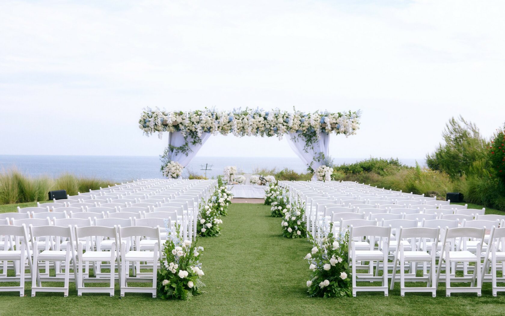 Coastal ceremony arch & aisle design