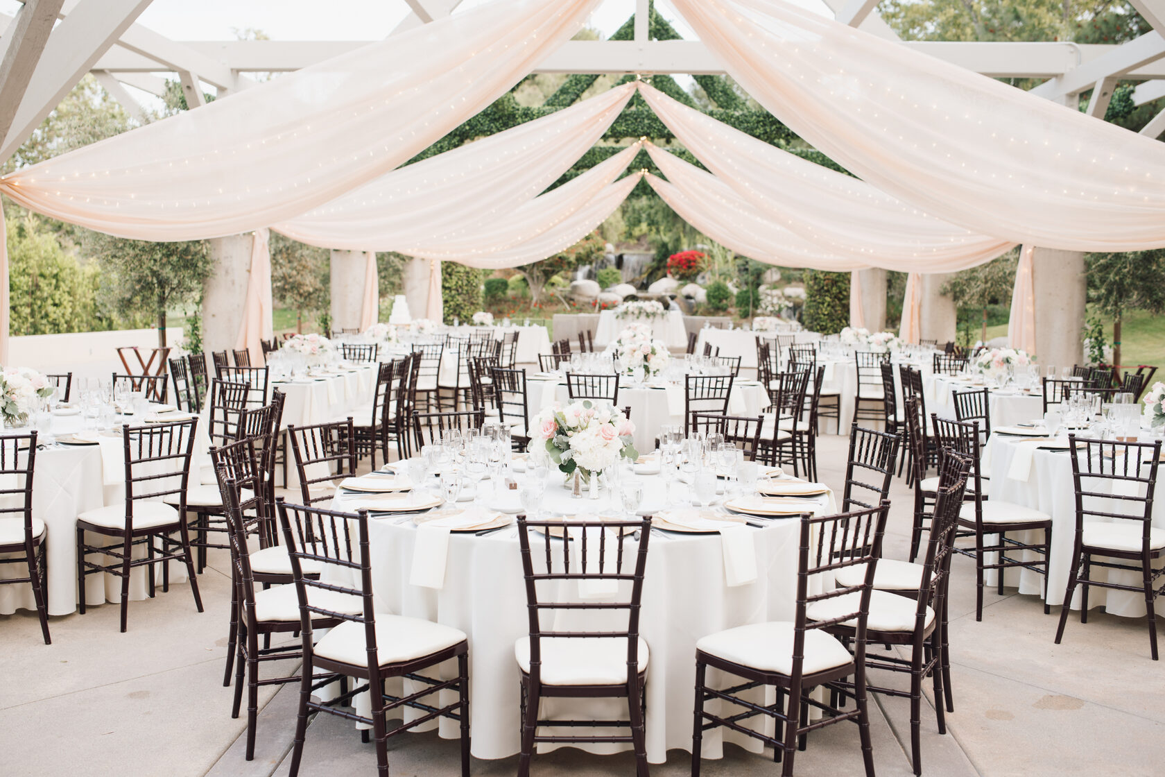 Draped reception tent & floral tablescapes