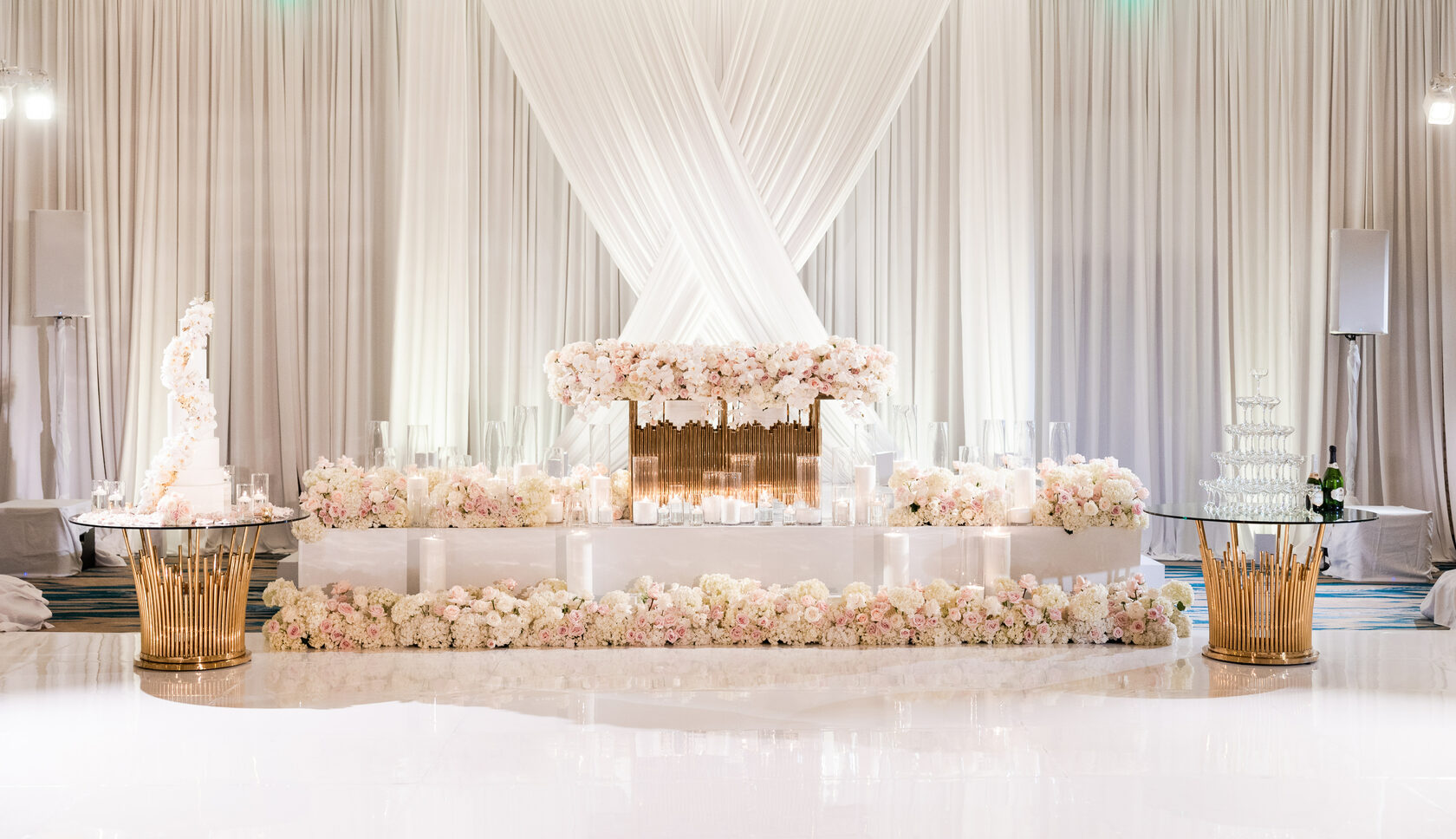 Draped sweetheart table with lush florals