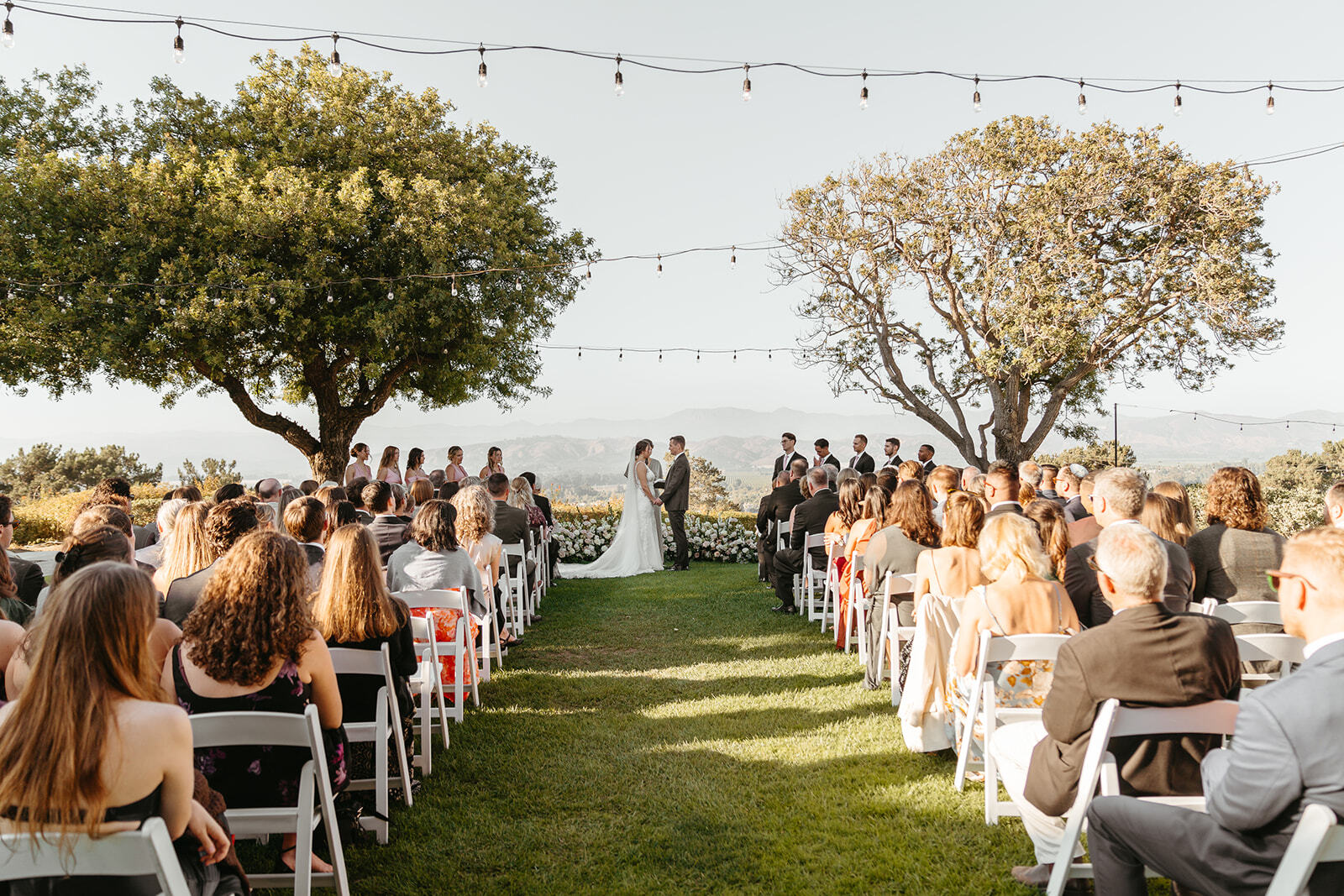 Garden ceremony under string lights